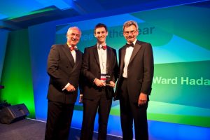 Terrific trainee – James Fairman of Ward Hadaway (centre) accepts the Trainee of the Year Award at the Northern Law Awards from (left) awards compere Colin Briggs of BBC Newcastle and (right) Geoff Harrison, Visiting Professor at Northumbria University.