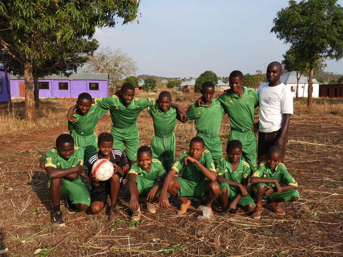 Pupils at Mshangano Secondary with the refurbished building in the background