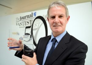'A special thing to win' – Tim Rice of A T & P Rentals with the awards for fastest growing medium-sized business and fastest growing overall business at the 2014 Ward Hadaway Fastest 50 Awards.