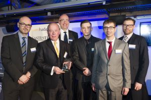 Kevin Griffin (second left), Jack Fieldhouse (fourth left) and Sahkel Hussain (fifth left) of Acrobat Carbon Services receive the Fastest Growing Large Business Award from Paul O'Halloran of MEN Media (first left), Paul Johnson of Ward Hadaway (third left) and Brad Miller of Manchester Airport (right)