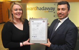 High standards – Ward Hadaway information security manager Jennifer Kilmartin receives the ISO 27001 status certificate from BSI UK & Ireland training director Shahm Barham.