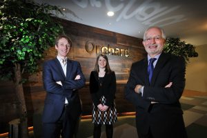 New home – (from left) Alex Wright and Tessa Petrides of Ward Hadaway with Orchard Finance Director Nick Lambert at the company's new offices.