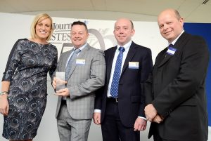 Success story - (second left) Terry McDonnell and Andy Nicol of Techflow Flexibles accept the award for fastest growing large business.